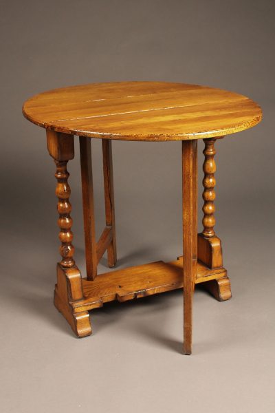 Custom made English oak dropleaf table constructed from 15th century oak timbers salvaged from Norwich cathedral.