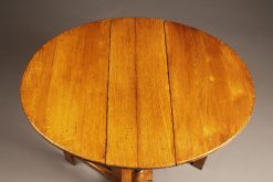 Custom made English oak dropleaf table constructed from 15th century oak timbers salvaged from Norwich cathedral.