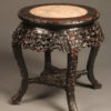 Heavily carved low Chinese table in rosewood with inset marble top