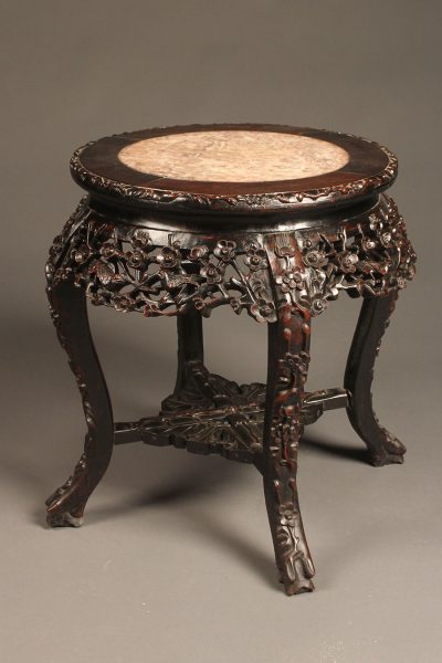 Heavily carved low Chinese table in rosewood with inset marble top