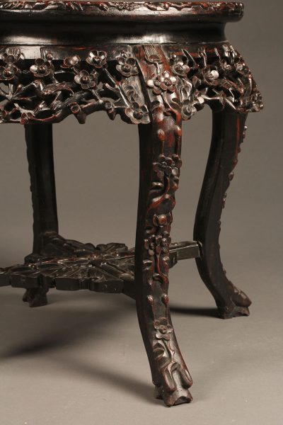 Heavily carved low Chinese table in rosewood with inset marble top