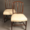 Late 19th century pair of English Hepplewhite side chairs, circa 1890.