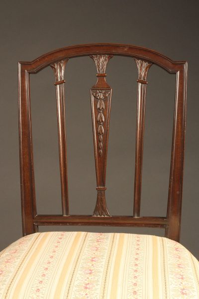 Late 19th century pair of English Hepplewhite side chairs, circa 1890.