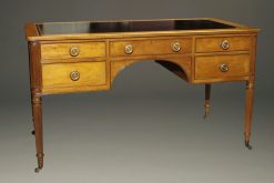 Lovely Kittenger writing desk in solid mahogany with black leather top and brass pulls