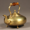 Late 19th century English brass tea pot with amber colored glass handle