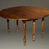 19th century French walnut kitchen table with drop leaves and fluted feet