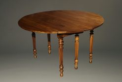 19th century French walnut kitchen table with drop leaves and fluted feet