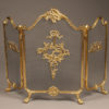 Solid brass folding fireplace screen with ornate castings.