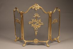 Solid brass folding fireplace screen with ornate castings.