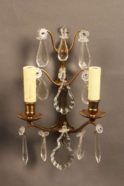 Pair of French 2 arm bronze and crystal sconces.