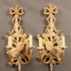 Pair of 2 arm hand carved Italian sconces with ribbon and musical instrument motif