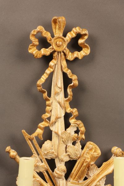 Pair of 2 arm hand carved Italian sconces with ribbon and musical instrument motif