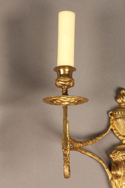 Pair of two arm French Louis XVI style bronze sconces.