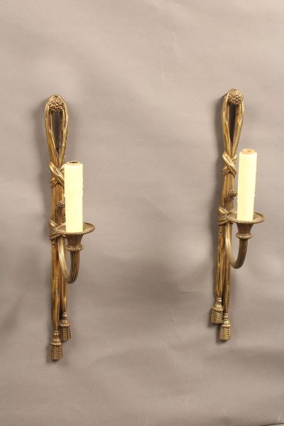 Very nice pair of French single arm bronze sconces.