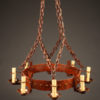 Late 19th century massive country French iron chandelier with 8 arms and reddish finish