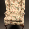 Chippendale style wingback arm chair with cabriole leg and ball and claw feet