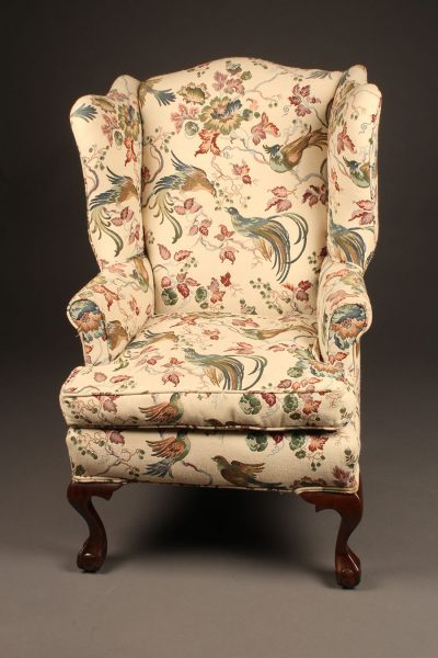 Chippendale style wingback arm chair with cabriole leg and ball and claw feet