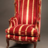 French Louis XV style wingback armchair with down cushion.