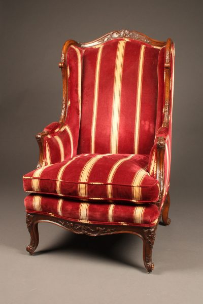 French Louis XV style wingback armchair with down cushion.