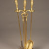 Very nice set of English brass fireplace tools with base