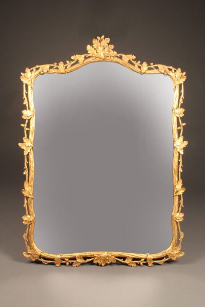 19th century French ornately carved and gilded mirror with oak leaf motif