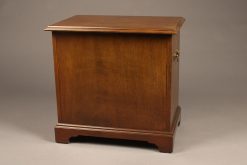 Small Chippendale style mahogany chest of drawers with brass handles on  sides