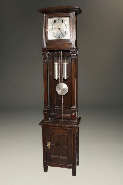 Oak German tall case clock with "open well"