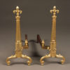 Pair of bronze andirons in fleur-de-lis motif.