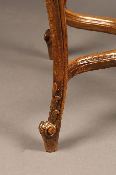 19th century French Louis XV style caned oak stool.