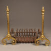 Late 19th century three piece set of brass English andirons with original iron basket